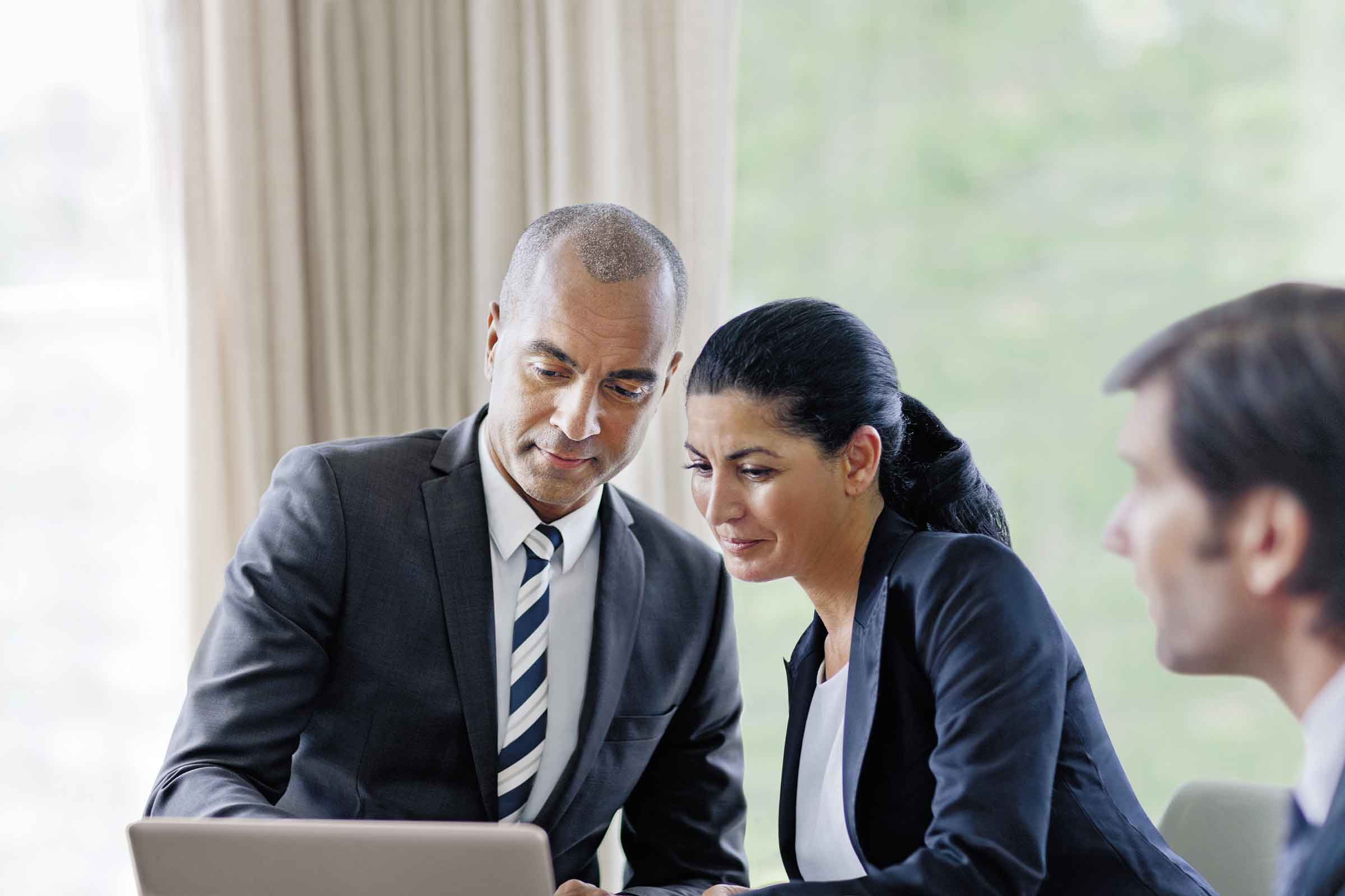 Advisor and client looking at computer